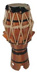 Of African origin, and made of jacarandá wood in a conical shape. A calfskin head covers the top of the drum. It is used a lot in capoeria and candomblé and umbanda rituals all over Brazil. There are three kinds of atabaques: Rum, Rumpi, and Lê. Rum has the deepest sound and is a solo drum; Rumpi has a medium sound, and Lê is the highest. These three hold the beat. 